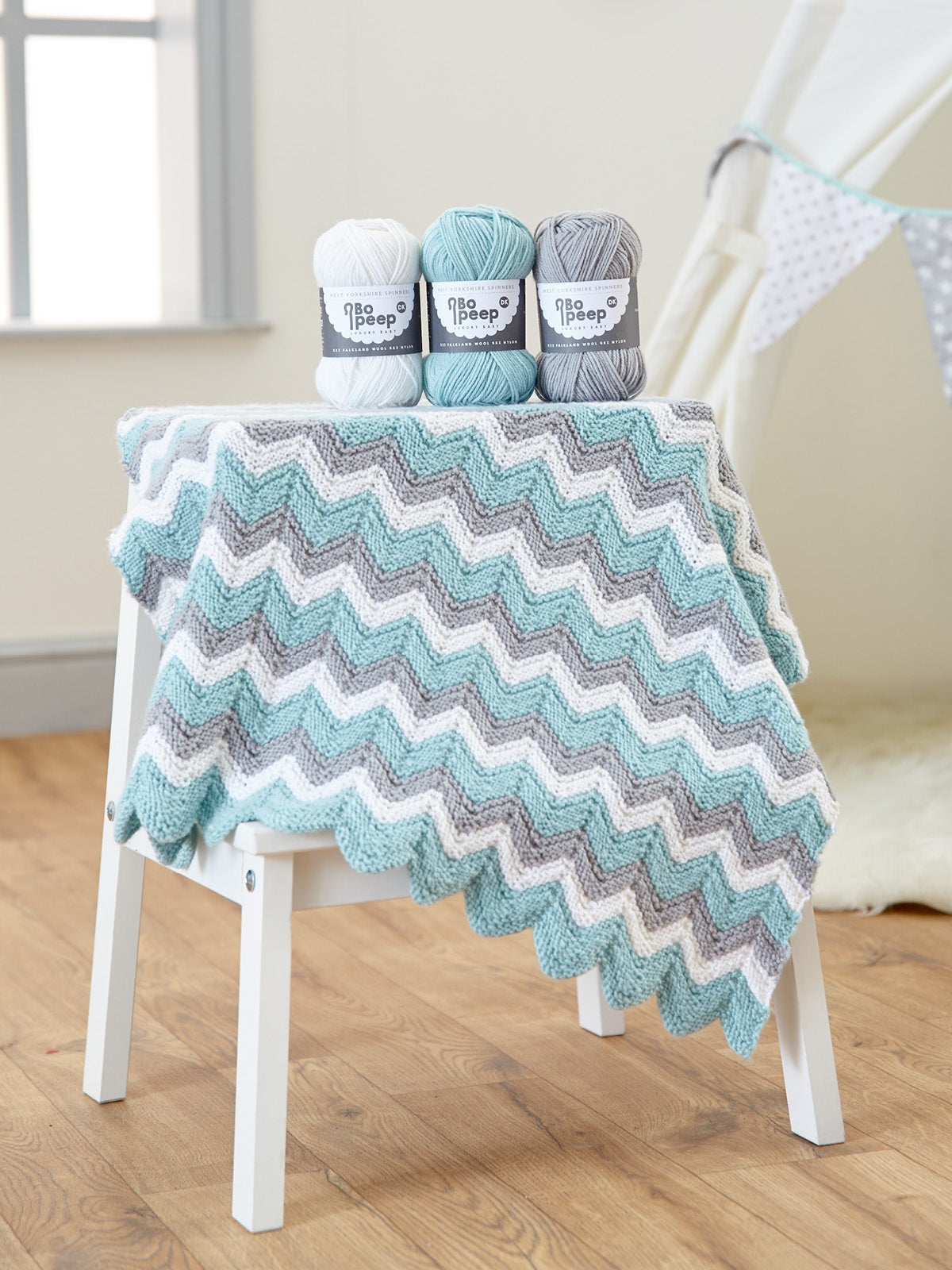 WYS Zig Zag Baby Blanket Knitting Pattern is available to purchase from The Knit Lounge UK knit shop