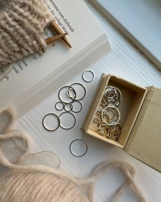 PetiteKnit Round Stitch Markers in a box of 50 available at The Knit Lounge UK yarn shop.